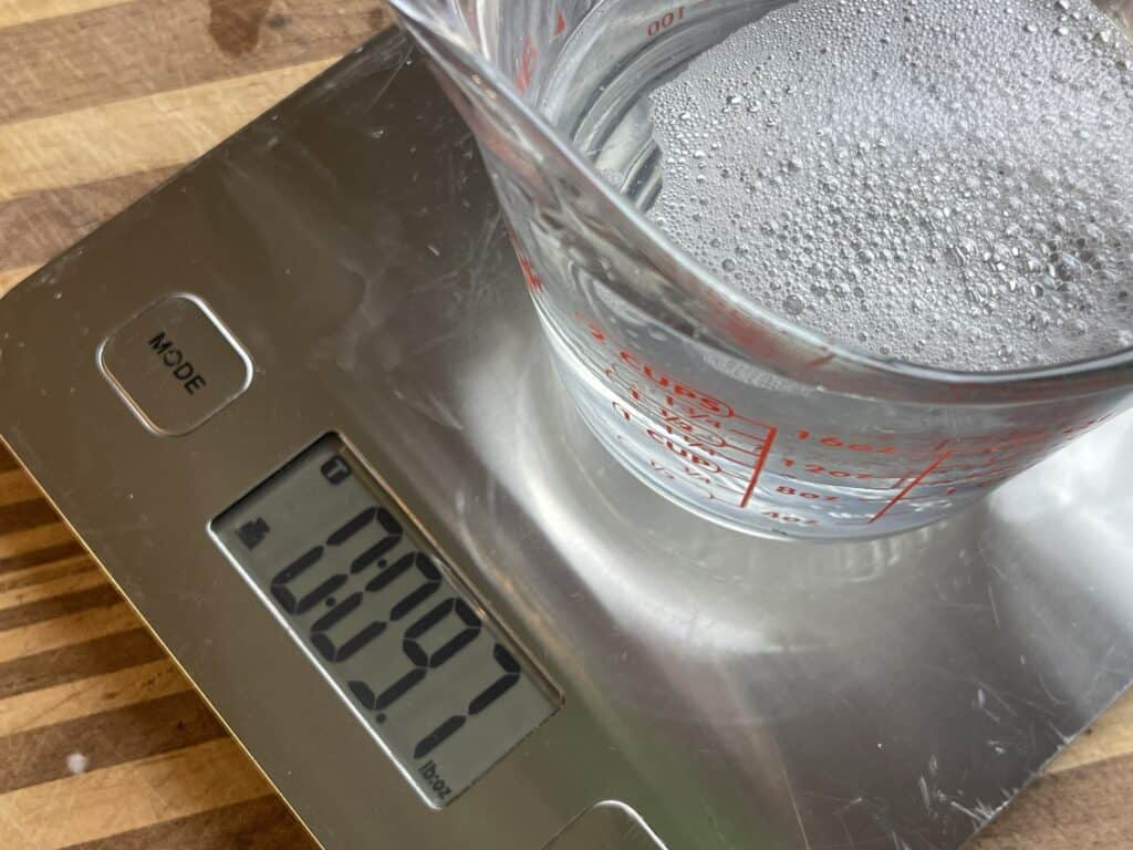 measuring cup on scale with water rough and tumble farmhouse